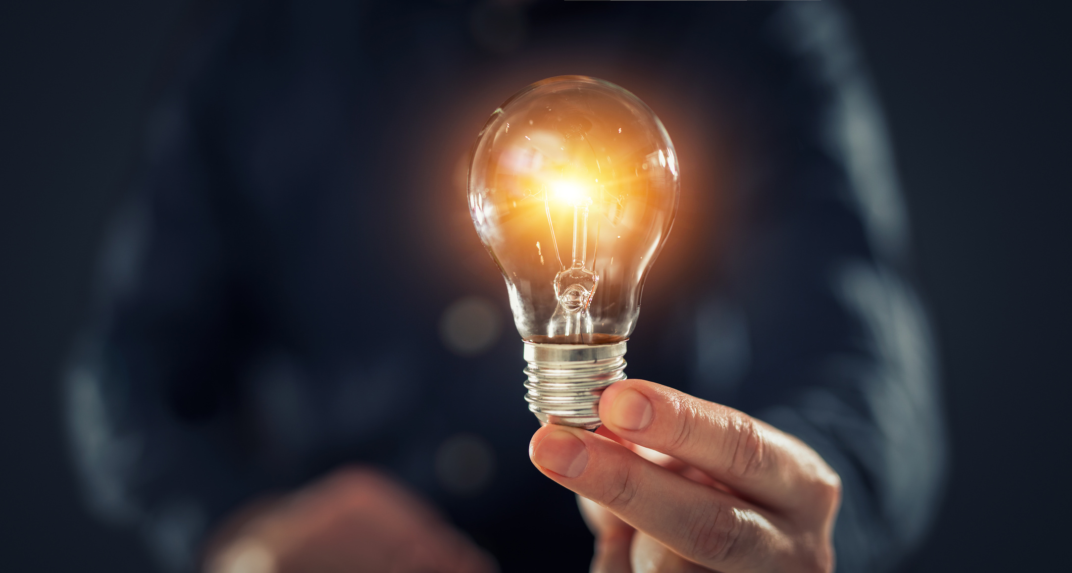 Man Holding Lightbulb 