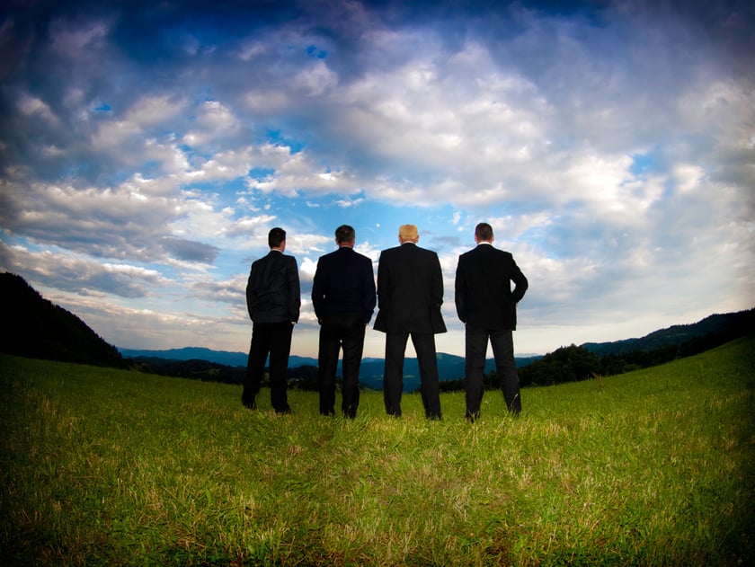 Four businessmen from behind